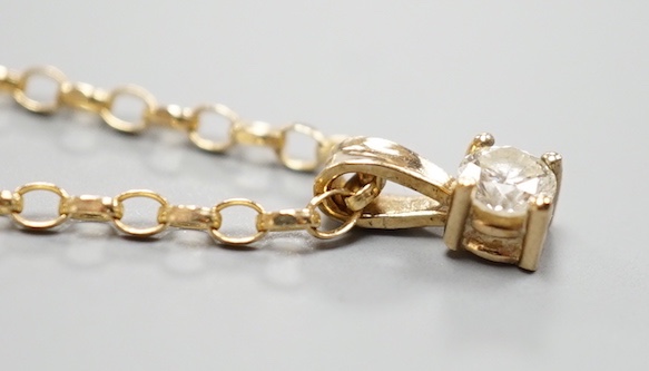 A modern 9ct gold and diamond set pendant, on a 9ct gold chain, chain, 38cm, gross weight 2.2 grams.